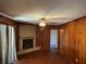 Living room with brick fireplace and wood-paneled walls at 2374 Woodcastle Se Ln, Atlanta, GA 30316