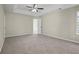 Light-filled bedroom features neutral carpet and an ensuite bath at 3649 Salem Glen Rd, Lithonia, GA 30038