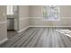 Dining area with stainless steel appliances and wood look floors at 3649 Salem Glen Rd, Lithonia, GA 30038