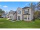 Beautiful two-story home featuring manicured lawn, dark roof, and green shutters at 3649 Salem Glen Rd, Lithonia, GA 30038