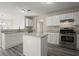 Modern kitchen featuring white cabinets, stainless steel appliances, and granite countertops at 3649 Salem Glen Rd, Lithonia, GA 30038