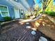 Charming backyard featuring a stone pathway winding through manicured garden beds at 4160 Tilly Mill Rd, Atlanta, GA 30360