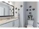 Elegant powder room with granite countertop, decorative mirrors and modern fixtures at 4160 Tilly Mill Rd, Atlanta, GA 30360