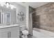 This bathroom includes a shower-tub, granite sink, and artistic wall decor at 4160 Tilly Mill Rd, Atlanta, GA 30360