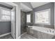 Spa-like bathroom showcases separate shower, tub, and tiled surround at 4160 Tilly Mill Rd, Atlanta, GA 30360