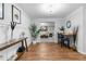 This hallway leads to a living room with comfortable furniture and modern artwork at 4160 Tilly Mill Rd, Atlanta, GA 30360