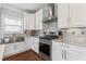 The kitchen features stainless steel appliances and white cabinets at 4160 Tilly Mill Rd, Atlanta, GA 30360