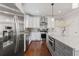 Modern kitchen with stainless steel appliances, white cabinets, and a center island with granite countertops at 4160 Tilly Mill Rd, Atlanta, GA 30360