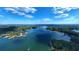 Aerial view of a lake with surrounding trees, showcasing waterfront living, recreational activities, and lush green views at 4308 Southside Dr, Acworth, GA 30101