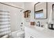 Bathroom with subway tile shower, white vanity, framed mirror, and modern fixtures at 4308 Southside Dr, Acworth, GA 30101