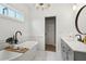 Elegant bathroom showcasing a freestanding tub, sleek vanity, and contemporary fixtures at 4308 Southside Dr, Acworth, GA 30101