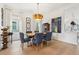 Elegant dining room features a wooden table, blue chairs, and natural light at 4308 Southside Dr, Acworth, GA 30101