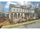 Street view of elegant homes featuring covered porches and manicured landscaping at 4308 Southside Dr, Acworth, GA 30101