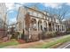 Street view of upscale homes featuring covered porches and well-maintained landscaping at 4308 Southside Dr, Acworth, GA 30101