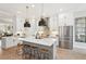 Modern kitchen featuring a large island, stainless steel appliances, and pendant lights at 4308 Southside Dr, Acworth, GA 30101