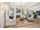 Bright living room featuring a fireplace, built-in bookshelves, and hardwood floors at 4308 Southside Dr, Acworth, GA 30101