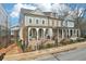 A lovely street view featuring multiple townhomes with inviting front porches and manicured lawns at 4308 Southside Dr, Acworth, GA 30101