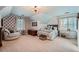 Spacious bedroom with unique patterned wallpaper and plenty of natural light from two large windows at 4742 Balmoral Ne Way, Marietta, GA 30068