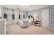 Bedroom featuring light carpet, a floral accent wall, and bright natural light at 4742 Balmoral Ne Way, Marietta, GA 30068