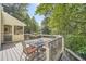 Deck with outdoor seating area and views of the trees and backyard at 4742 Balmoral Ne Way, Marietta, GA 30068