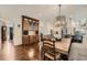 Bright dining area featuring hardwood floors, a large table with seating, and a decorative chandelier at 4742 Balmoral Ne Way, Marietta, GA 30068