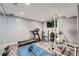 Spacious exercise room with a treadmill, weight machine, and mounted television at 4742 Balmoral Ne Way, Marietta, GA 30068