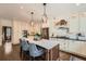 Spacious kitchen featuring bar stool seating at the island, stainless appliances, and subway tile backsplash at 4742 Balmoral Ne Way, Marietta, GA 30068