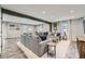 Basement living room with a large sectional sofa, a TV, and wood plank flooring at 4742 Balmoral Ne Way, Marietta, GA 30068