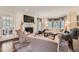 Elegant living room featuring a fireplace, large windows, and comfortable seating at 4742 Balmoral Ne Way, Marietta, GA 30068