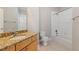 Bathroom includes a granite vanity, a large mirror, and a shower-tub combination at 799 Hammond Dr # 219, Atlanta, GA 30328