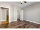 Bedroom with wood floors, a walk-in closet, and doorway to the bathroom at 799 Hammond Dr # 219, Atlanta, GA 30328