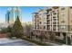 Attractive condominium building with multiple balconies and views of the city skyline at 799 Hammond Dr # 219, Atlanta, GA 30328