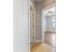 Hallway with hardwood floors leading to the bedroom, featuring a ceiling fan at 799 Hammond Dr # 219, Atlanta, GA 30328