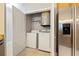 A laundry room with a washer and dryer, and a closet with shelves for storage at 799 Hammond Dr # 219, Atlanta, GA 30328