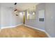 A light and open living room with hardwood floors and a modern light fixture at 799 Hammond Dr # 219, Atlanta, GA 30328