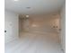Large bonus room with neutral walls, carpet, white trim, and multiple doors at 133 Ward'S Crossing Way # 18, Johns Creek, GA 30022
