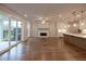 Inviting living area showcases hardwood floors, fireplace, and access to outdoor living space at 133 Ward'S Crossing Way # 18, Johns Creek, GA 30022