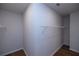 Walk-in closet with shelving and hardwood floors at 133 Ward'S Crossing Way # 18, Johns Creek, GA 30022