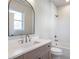 Bathroom showcasing a vanity with a large mirror and a shower/tub combo with white subway tile at 145 Cedarwood Ln, Roswell, GA 30075