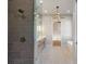 Bathroom showing tile shower and lighting fixtures at 145 Cedarwood Ln, Roswell, GA 30075