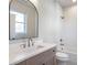 Bathroom showing white subway tile shower, vanity and toilet at 145 Cedarwood Ln, Roswell, GA 30075