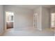 Spacious bedroom with neutral carpet flooring, leading to a well-appointed ensuite bathroom at 145 Cedarwood Ln, Roswell, GA 30075