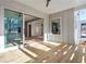 Inviting covered deck featuring wood flooring and a sliding glass door offering views of the interior living space at 145 Cedarwood Ln, Roswell, GA 30075