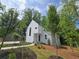 Charming two-story home with modern architecture and landscaped front yard at 145 Cedarwood Ln, Roswell, GA 30075
