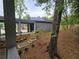 Exterior view of covered walkway to detached garage. Solar panels are on the garage roof at 145 Cedarwood Ln, Roswell, GA 30075