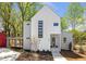 Contemporary two-story home featuring modern windows and a well-maintained front yard at 145 Cedarwood Ln, Roswell, GA 30075