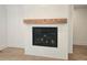 Close-up of modern living room fireplace with black trim and wooden mantel at 145 Cedarwood Ln, Roswell, GA 30075