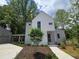 Charming two-story home with modern architecture and landscaped front yard at 145 Cedarwood Ln, Roswell, GA 30075