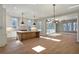 Spacious kitchen with a large island, modern appliances, and ample natural light from the surrounding windows at 145 Cedarwood Ln, Roswell, GA 30075