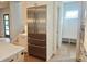 Bright kitchen features stainless steel refrigerator and mudroom entrance at 145 Cedarwood Ln, Roswell, GA 30075